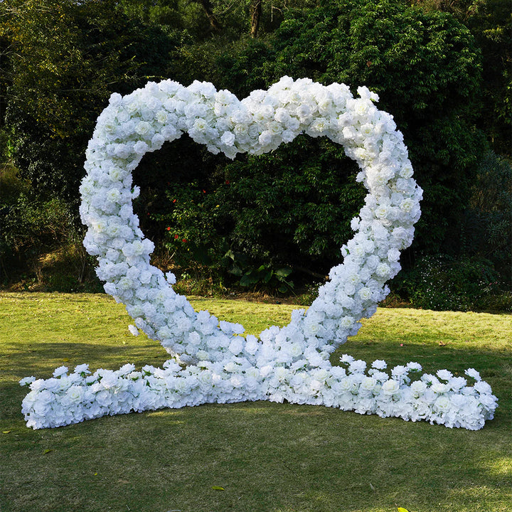 White heart-shaped wedding party background floral arch decoration