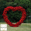 Red simulation rose heart shaped wedding party background floral arch decoration