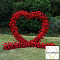 Red simulation rose heart shaped wedding party background floral arch decoration