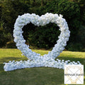 White heart-shaped wedding party background floral arch decoration